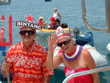 King and Queen Neptune weaing crowns made from Bintang beer boxes
